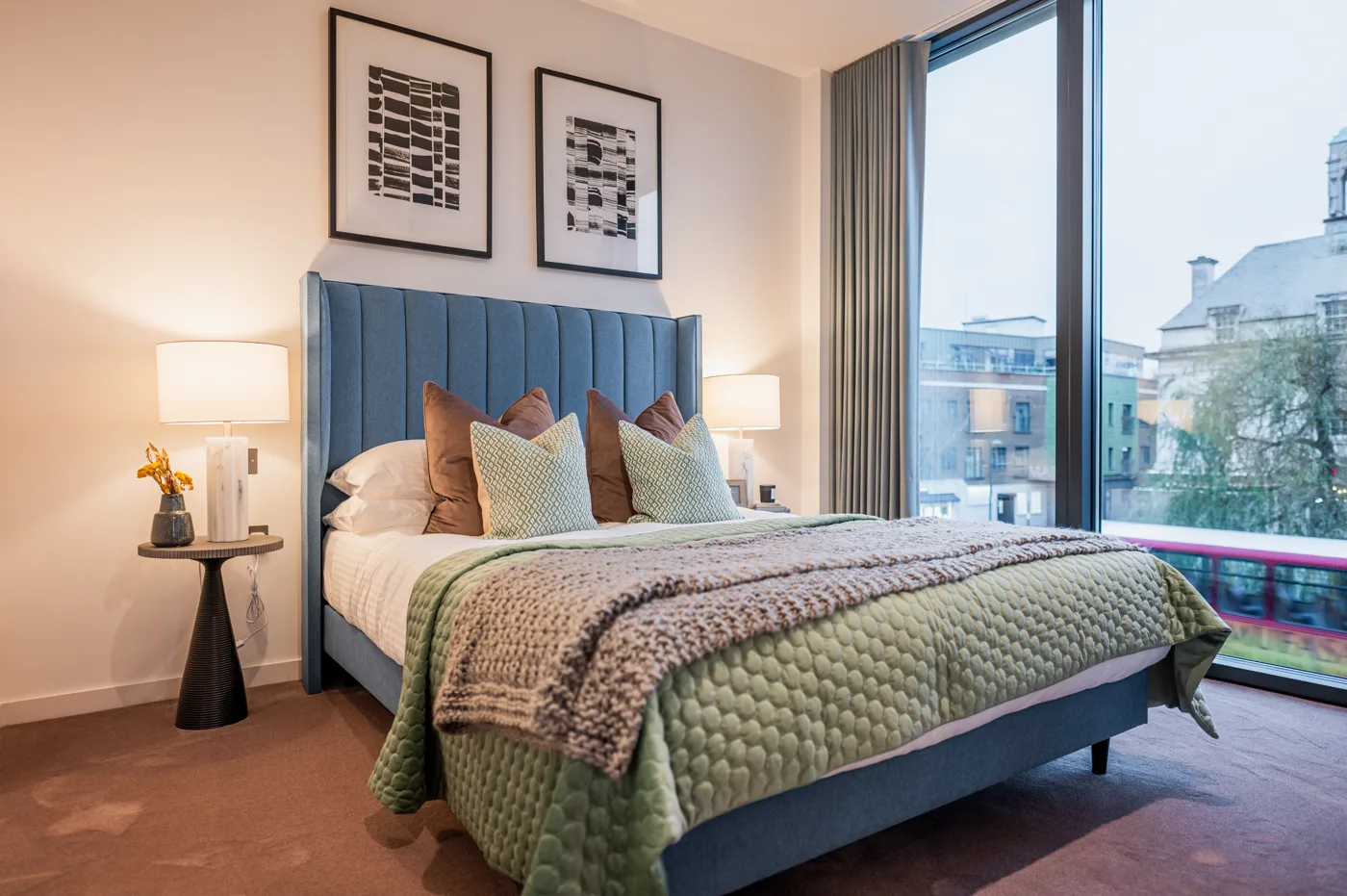 Bedroom with floor-to-ceiling windows in a property marketed by Dwelling & Manor